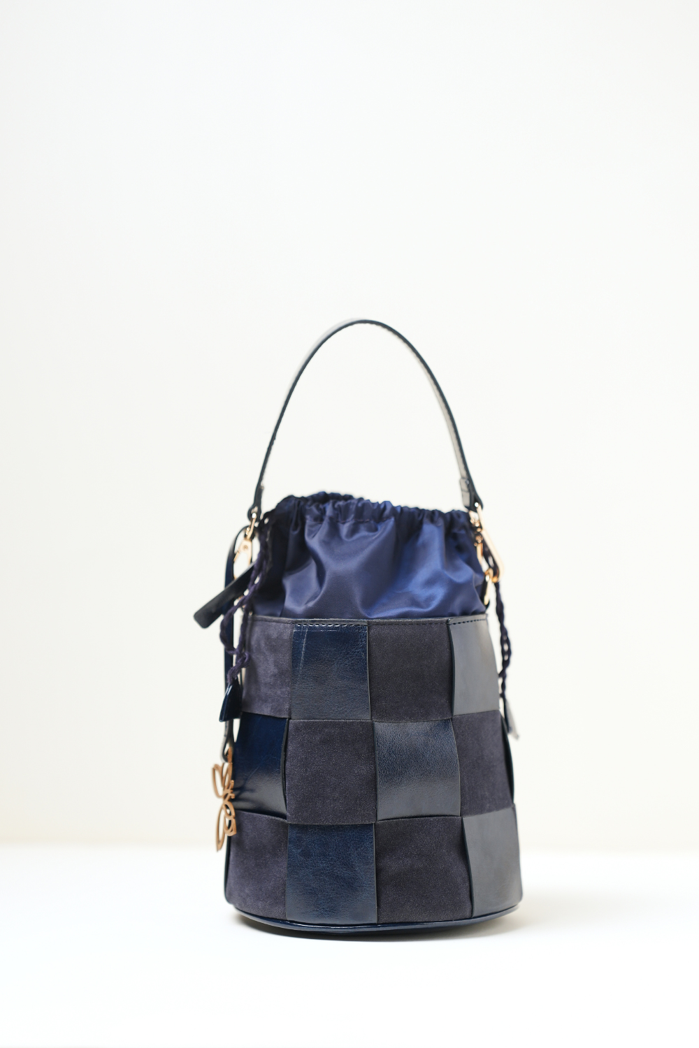 Minimal front view of the Derby Bucket Bag Blue against a clean background, highlighting its simple silhouette.