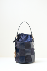 Minimal front view of the Derby Bucket Bag Blue against a clean background, highlighting its simple silhouette.