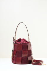 Derby Bucket Bag Burgundy shown in full front view with its structured bucket silhouette and rich burgundy colour.