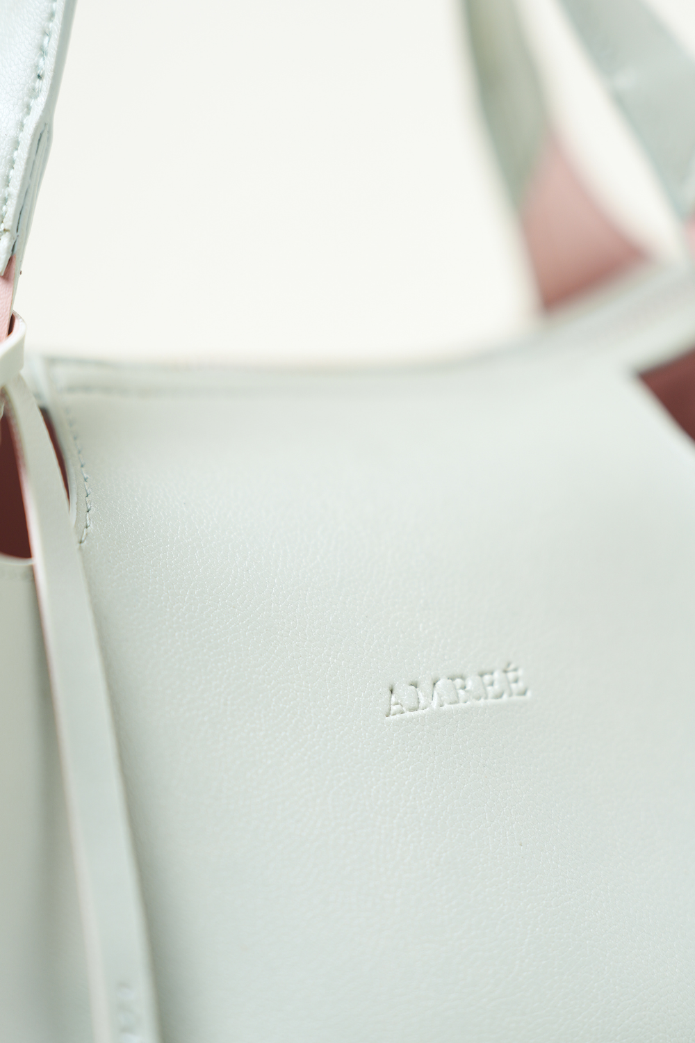 Close-up of Equitana Top Handle Mint bag highlighting texture and stitching.