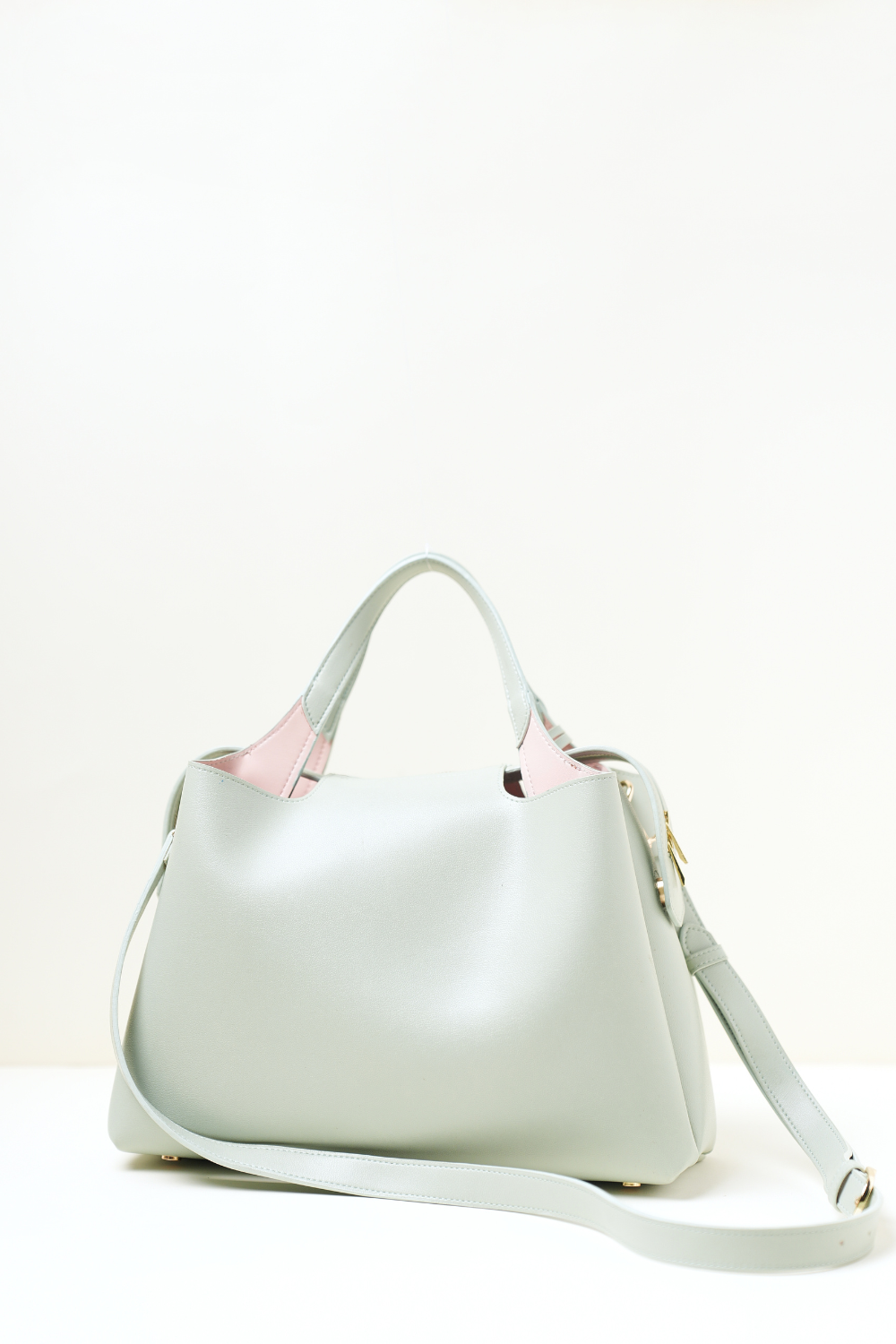 Equitana Top Handle Mint bag photographed to highlight its colour and sleek construction.
