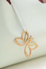 Close-up of the Equitana Top Handle Mint handbag showing the Amrée logo detailing on the front.