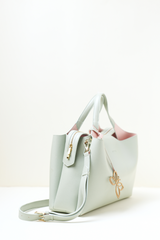 Equitana Top Handle Mint handbag in soft mint green placed on a clean background.