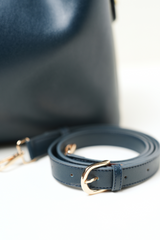 Equitana Top Handle Navy bag styled for everyday wear against a neutral setup.