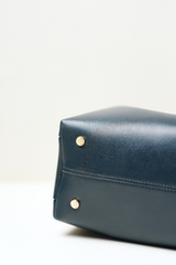 Close-up of the Equitana Top Handle Navy handbag showing its refined leather texture, stitching, and premium finish.