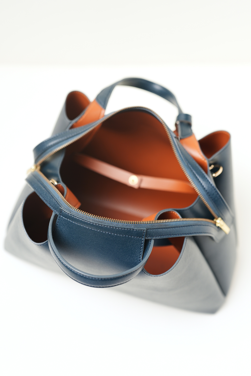 Top-down view of the Equitana Top Handle Navy handbag showing handle and opening.