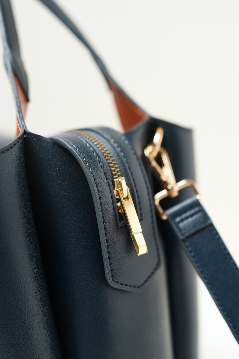 Top-down view of the Equitana Top Handle Navy handbag showing handle and opening.