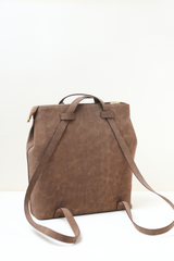 Back side of the Rodeo Totepack Brown showing backpack straps and minimal panel design.