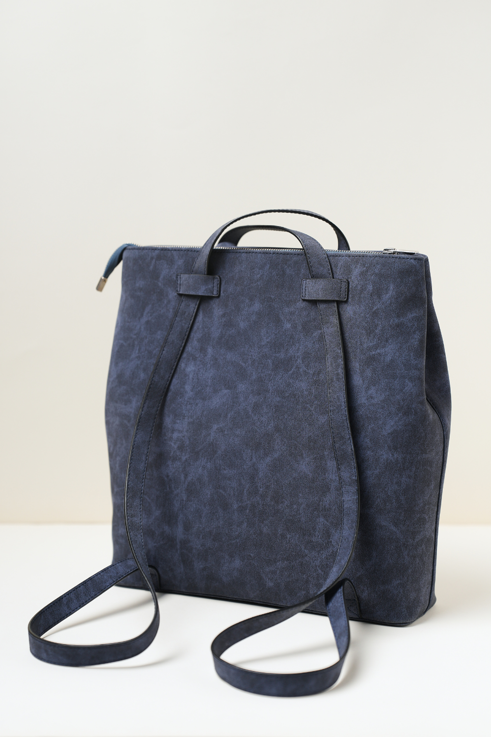 Back side view of the Rodeo Totepack Blue showing backpack straps, clean panel design, and Amrée’s structured craftsmanship.