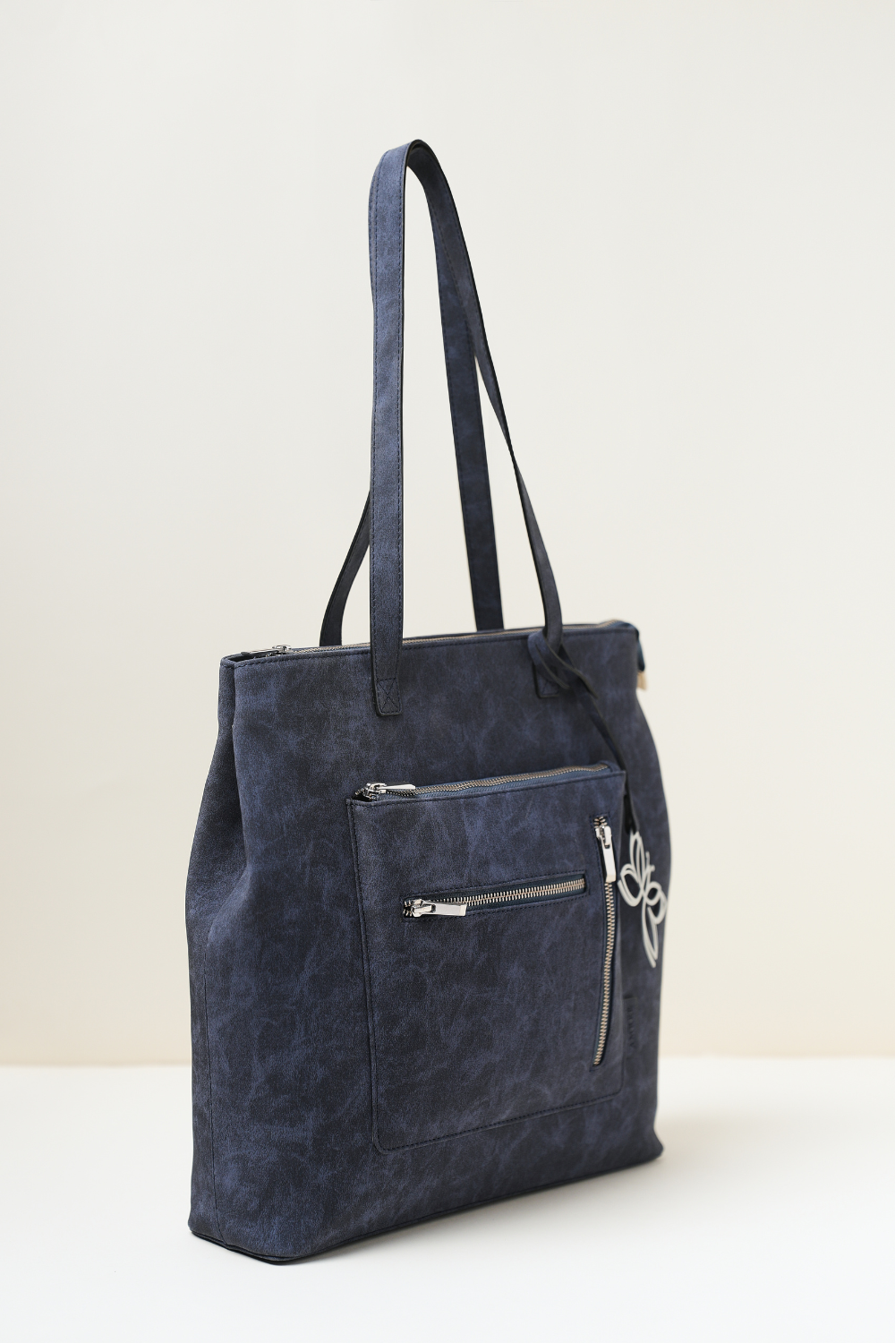 Blue Rodeo Totepack displayed from a side angle highlighting its sleek profile and stitching.