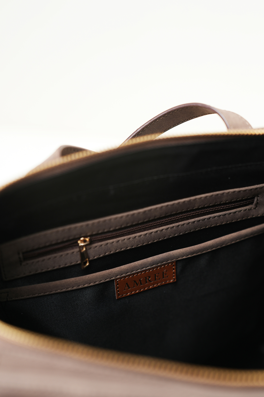 Top view of the Rodeo Totepack Brown showing the inner pocket with zipper detailing.