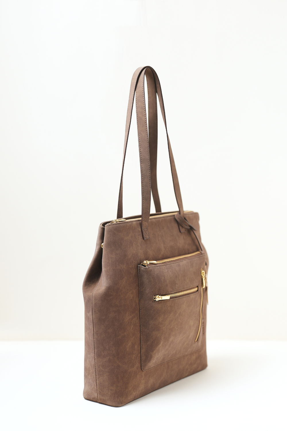 Brown Rodeo Totepack photographed from a side angle highlighting its clean profile and premium finish.