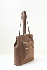 Brown Rodeo Totepack photographed from a side angle highlighting its clean profile and premium finish.