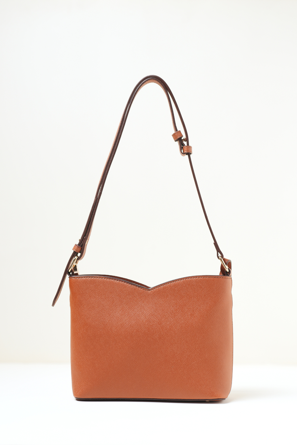 Back view of the Rosette Sling Tan showing the clean panel and minimal design.