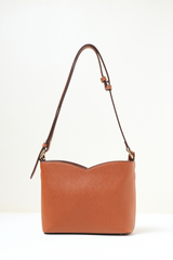 Back view of the Rosette Sling Tan showing the clean panel and minimal design.
