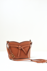 Rosette Sling Tan photographed to emphasise its rich tan colour and smooth textured material.