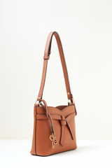 Side angle view of the Rosette Sling Tan showing its curved profile and premium stitching.