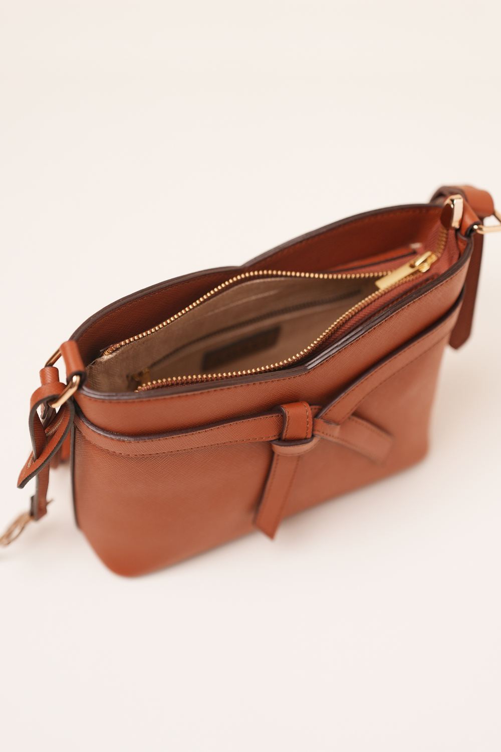 Top view of the Rosette Sling Tan showing the opening and strap attachment points.