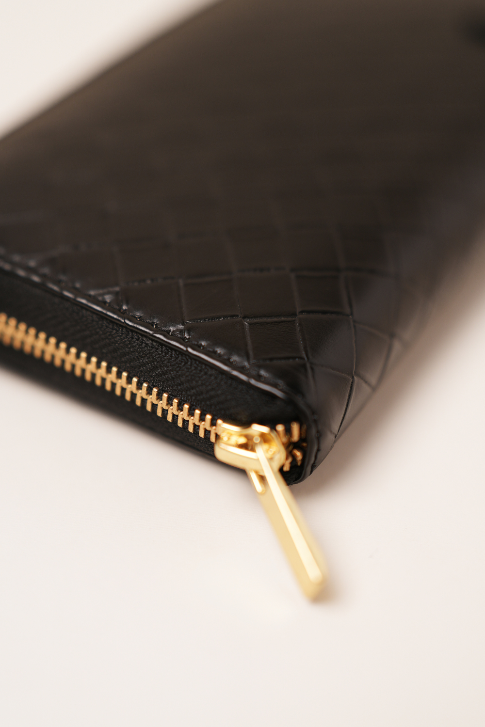 Side angle view of The Filly Wallet showing its slim profile and refined stitching.